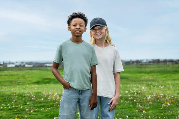 Two kids in youth tees